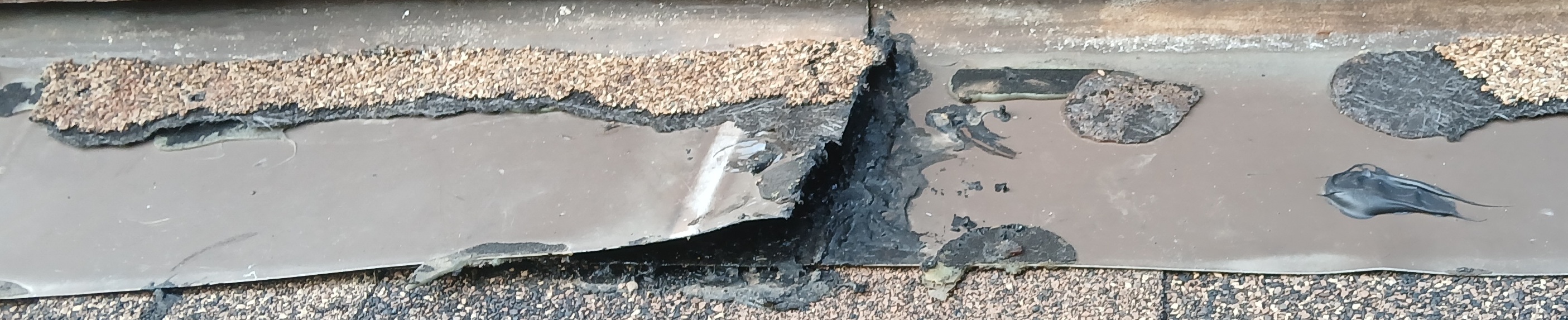 Re-used damaged roofing materials and improper installation by Summit Roofing